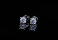 4 prongs round cut solitaire earrings